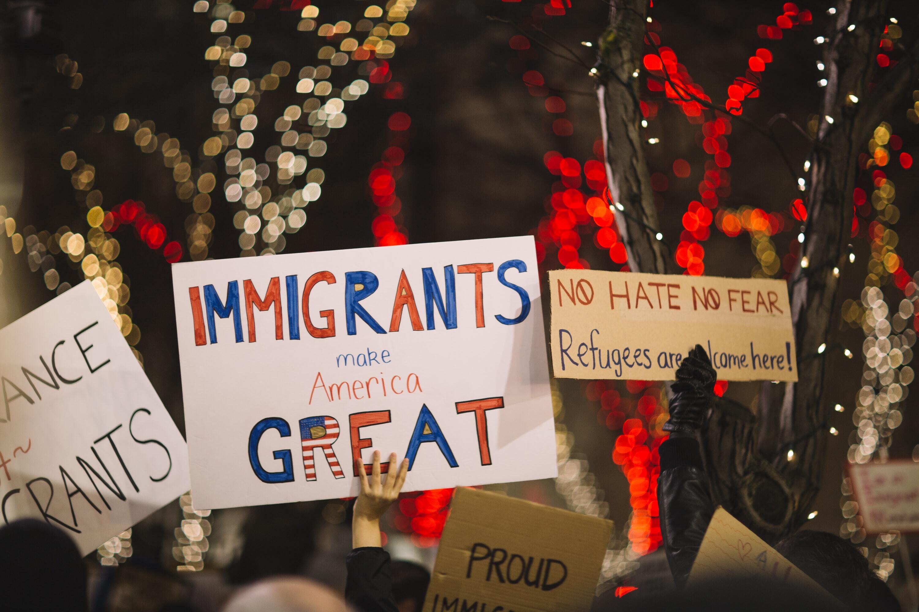 Sign at rally reads 'Immigrants Make America Great'