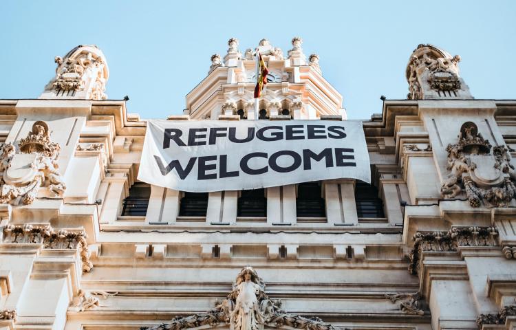 Refugees Welcome banner on building in Madrid, Spain