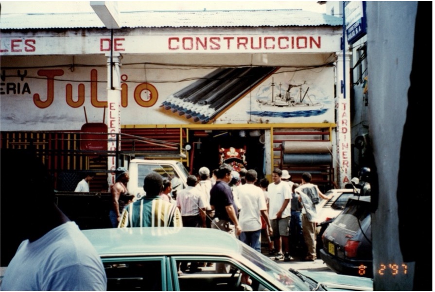 A business in Colon, Panama, surrounded by locals.
