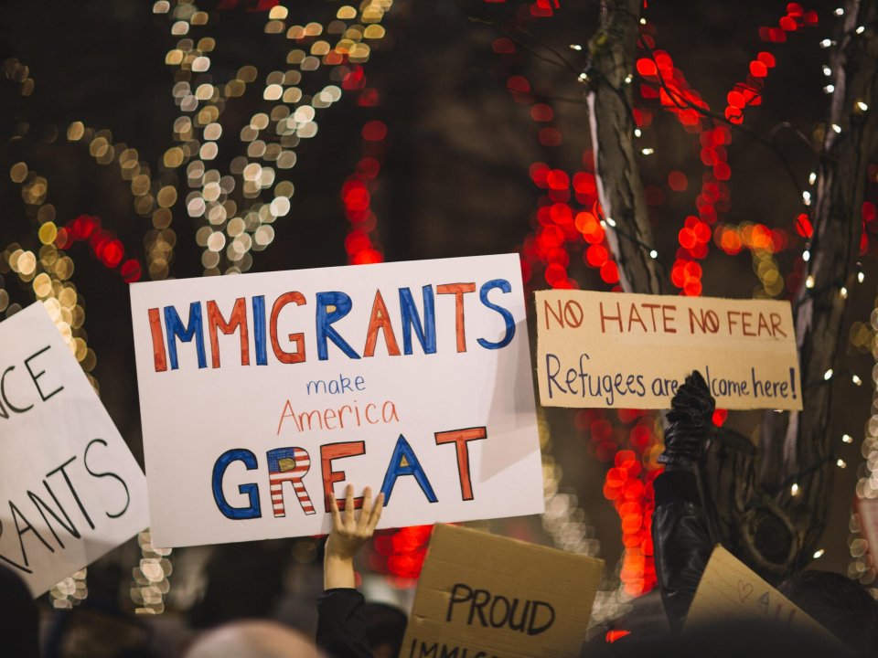Sign at rally reads 'Immigrants Make America Great'