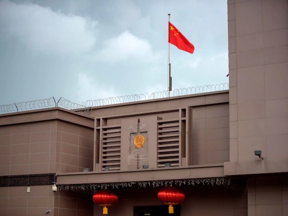 Chinese flag flies over Houston consulate.