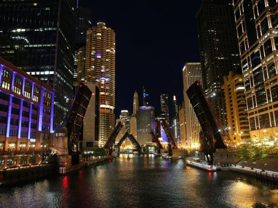 Bright downtown lights illuminate the Chicago River in June. (Chris Sweda / Chicago Tribune)
