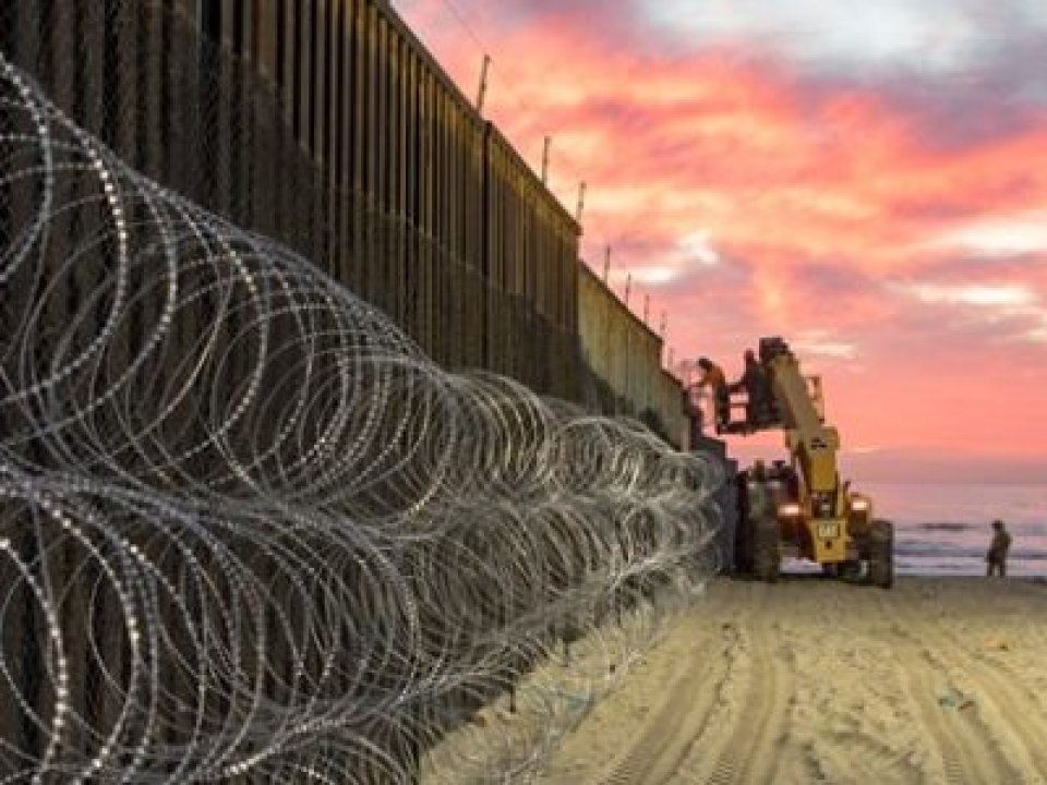 Personnel reinforcing the border fence. Photo by US Department of Defense, CC 181115-H-VJ018-0008