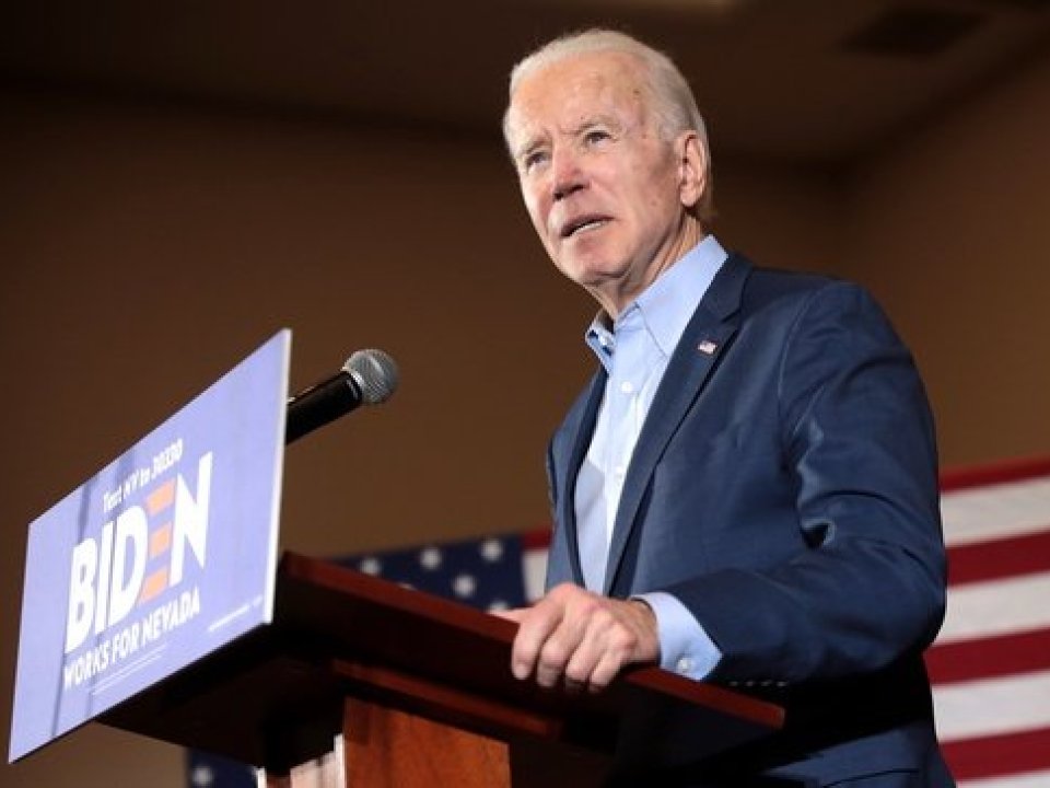 Joe Biden speaks behind a podium at a campaign event