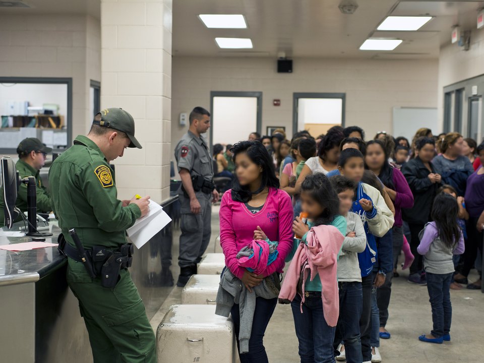 Unaccompanied immigrant children talk to border patrol