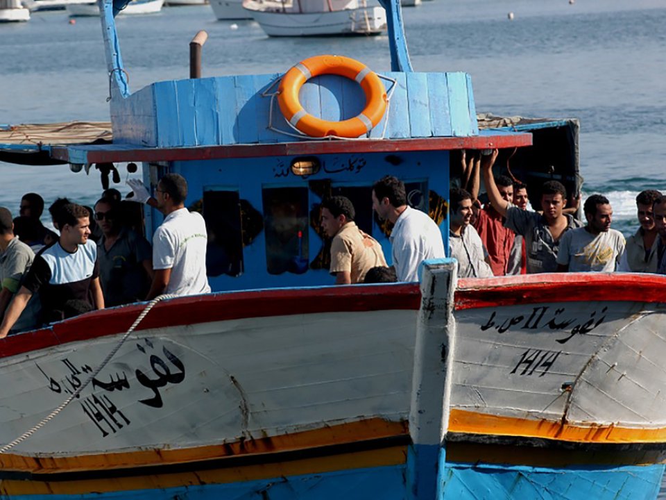 Migrants Arrive on Boat in Mediterranean