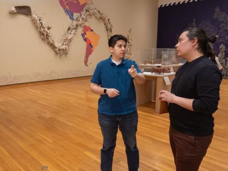 Sebastian Young, left, and Rodrigo Guzman-Serrano, stand in the Guadalupe Maravilla exhibit at the Johnson Museum.