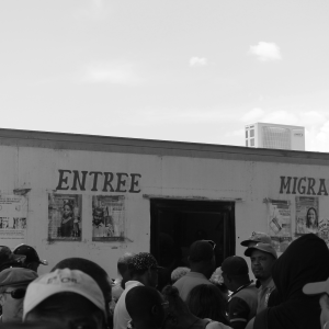 Tourists and Haitian migrants waiting in line at the migration processing center to enter the Dominican Republic.